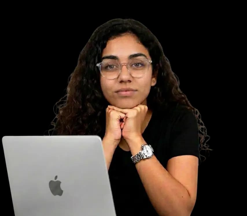 Workshop instructor sitting behind a laptop