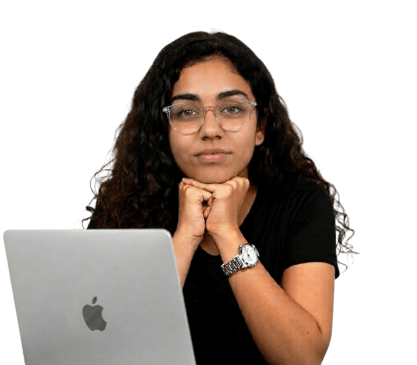 Workshop instructor sitting behind a laptop